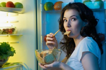 woman eating fridge chips