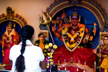 woman praying in temple