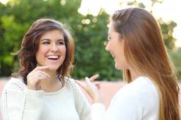Two Young Women Talking Outdoor
